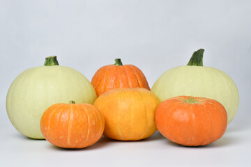 Various ripe pumpkins on a white background