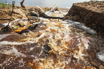 Mountain small river water stream landscape. Wild rill stream rocks flowing. Downpour stream.