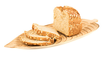 Loaf of bread on the wooden tray on white background.