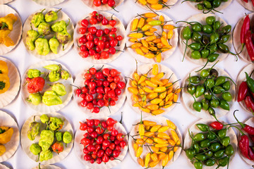 Various Kinds of Pepper in Small Paper Plates at Brazilian Market