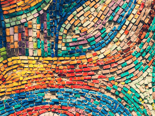 Detail of beautiful old collapsing abstract ceramic mosaic adorned building. Venetian mosaic as decorative background. Selective focus. Abstract Pattern. Abstract mosaic colored ceramic stones