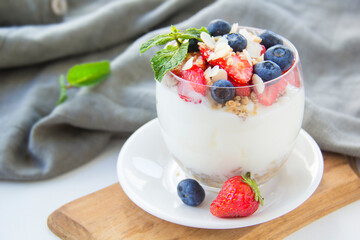 Healthy blueberry, strawberry and walnut parfait in a glass 