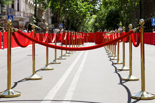 Way to success on the red carpet (Barrier rope). Selective focus