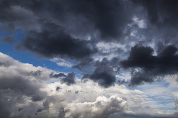 Epic Storm sky, dark grey and white rain clouds background texture