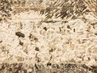 Abstract background of the old wall of black natural stone with cracks and scratches. Landscape...