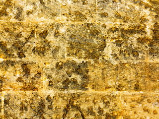 Abstract background of the old wall of black natural stone with cracks and scratches. Landscape...