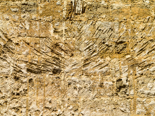 Abstract background of the old wall of black natural stone with cracks and scratches. Landscape...