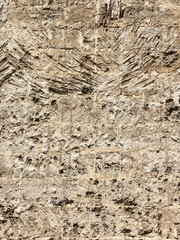 Abstract background of the old wall of black natural stone with cracks and scratches. Landscape style. Great background or texture.