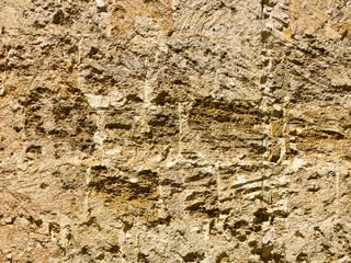 Abstract background of the old wall of black natural stone with cracks and scratches. Landscape...