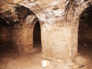 Mystic interior of an ancient dungeon. An old abandoned tunnel in an underground wine cellar....