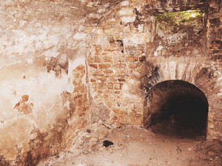 Mystic interior of an ancient dungeon. An old abandoned tunnel in an underground wine cellar....
