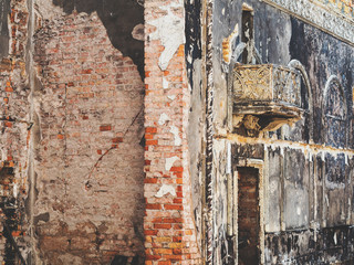 The fire damaged interior details in the old house. Antique hall after the fire. A terrifying landscape interior damaged by fire. The old house was destroyed by fire during the arson.
