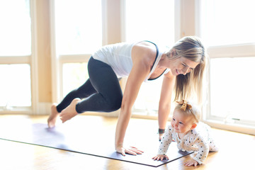 woman's fitness with baby at home