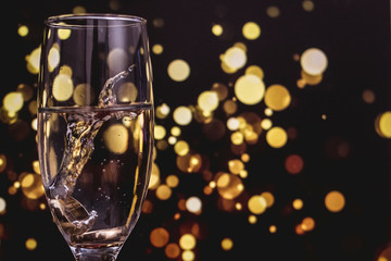 two glasses of champagne on a black background