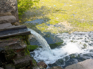 Sewage drains into the river, the sea, the lake. Environmental pollution. Wastewater, ecological...