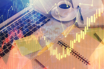 Multi exposure of forex graph drawing and desktop with coffee and items on table background. Concept of financial market trading