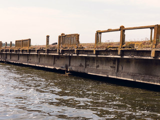 Fragment of reinforced concrete structures of the old bridge for transport near Odessa, Ukraine. Perspective view