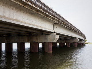 Modern bridge for the mass rapid transit near Odessa, Ukraine. Concrete structure in need of repair. Perspective view