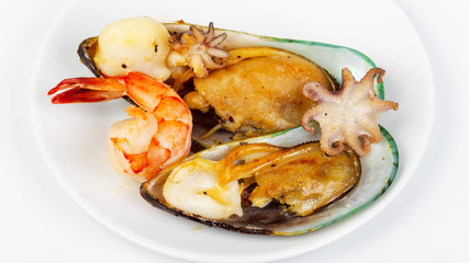 Seafood. Delicious gourmet food on the table. Gourmet cuisine in white dish. Creative restaurant concept.