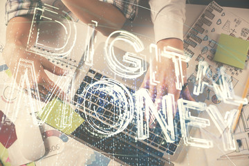 Double exposure of man and woman working together and crypto theme hologram drawing. Computer background. Blockchain concept. Top View.