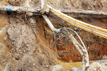 Pipes and cables. Repair of communications. Water supply, electricity, Sewerage. Excavated roads in...