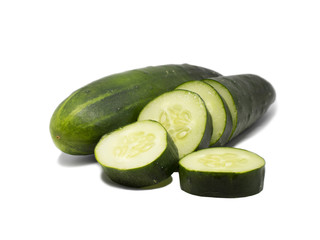 Cucumbers and slices on a white background