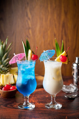 Summer cocktail image, pina colada and blue hawaii