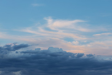 Fototapeta na wymiar Beautiful atmospheric dramatic clouds in the evening at sunset.