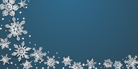 Christmas background with volume paper snowflakes with soft shadows on blue background