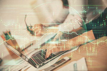 Multi exposure of woman hands typing on computer and financial chart hologram drawing. Stock market analysis concept.