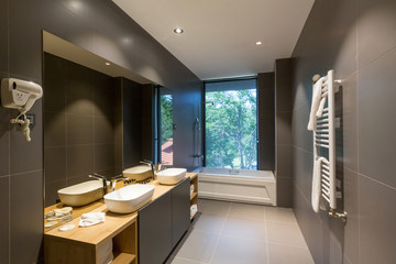 Interior of a luxury hotel bathroom with bathtub