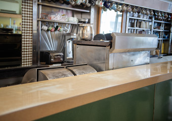 Traditional 1950's diner with stainless steel equipment.