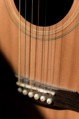 Obraz premium Close-up guitar with half sun highlight and shadow