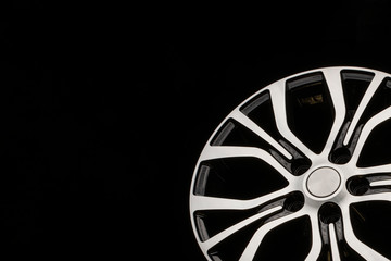 new modern alloy wheels, black with a polished front part. Close-up tuning detail, auto parts....