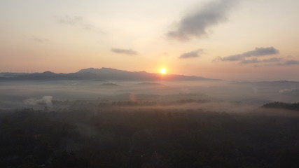Aerial view of sunrise with light mist. Mount Ireng Gunungkidul Yogyakarta