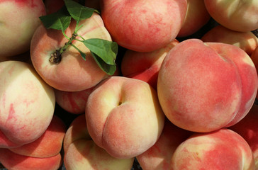 Fresh sweet ripe peaches as background