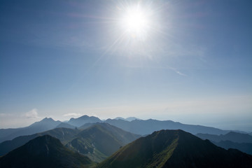 Naklejka premium the peaks of the Fagaras mountains on a foggy day