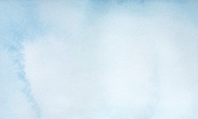 Light blue water color background with soft artistic washes, stains and brush strokes. Hand drawn watercolour graphic paint. Beautiful backdrop for design, card, invitation, cover, scrapbook, poster.