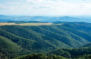 Fototapeta na wymiar landscape with many wooded hills