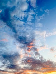 Blue sky with white clouds at sunset in summer time.Free space.