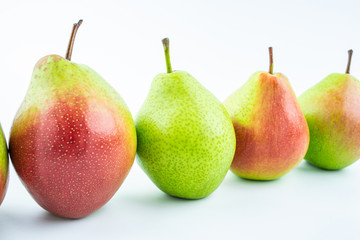 Fresh red crispy pears on white background