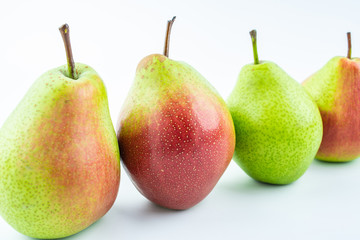 Fresh red crispy pears on white background