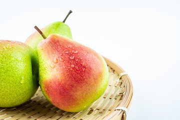 Fresh red crispy pears on white background
