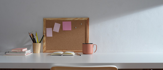Study table with copy space, stationery, memory board and school elements