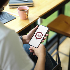 Female university student relaxing mock up smartphone