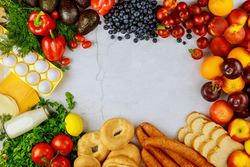 Assorted fresh fruits, vegetables and groceries. Copy space.