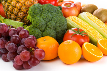 Variety of fresh fruits and vegetables on white background