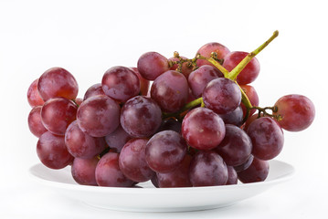 Ripe red grape isolated on white background.