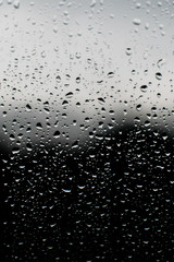 Rain droplet on window with backrgound