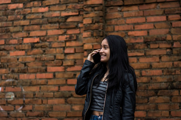 Fototapeta na wymiar young woman with mobile phone